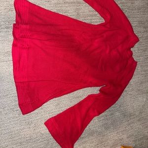 Woman’s long sleeve red blouse with bell sleeves